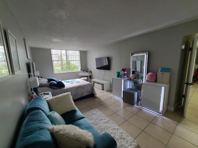 bedroom with light tile floors