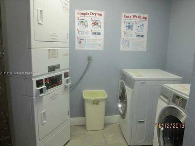 washroom with light tile floors, separate washer and dryer, and stacked washer and dryer