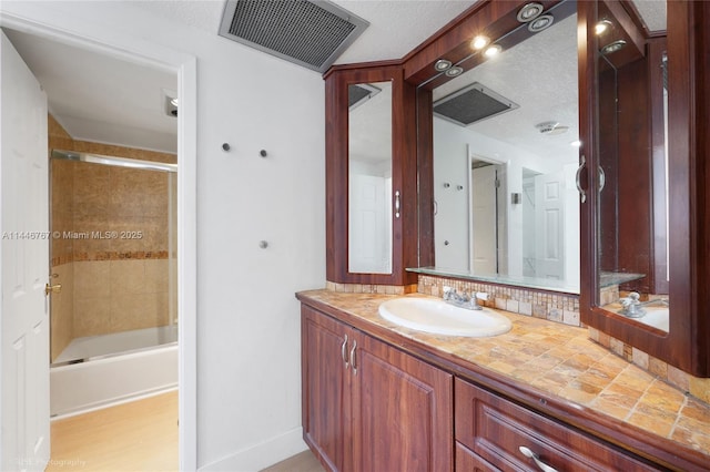 bathroom with vanity and shower / bathtub combination