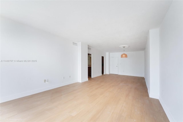 empty room featuring light hardwood / wood-style floors