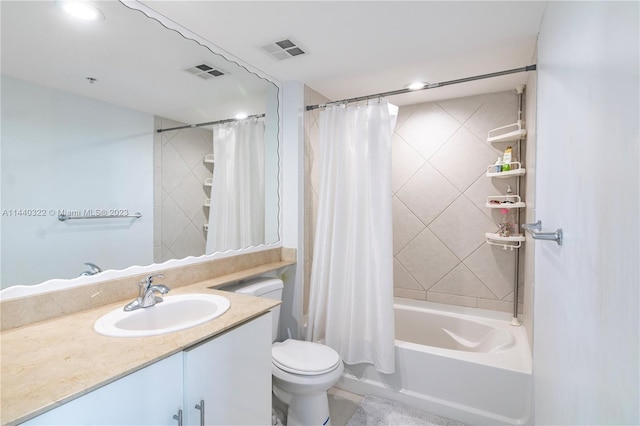 full bathroom featuring toilet, shower / bathtub combination with curtain, and vanity with extensive cabinet space