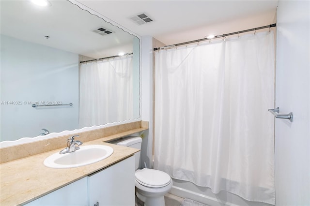 bathroom featuring toilet and vanity with extensive cabinet space