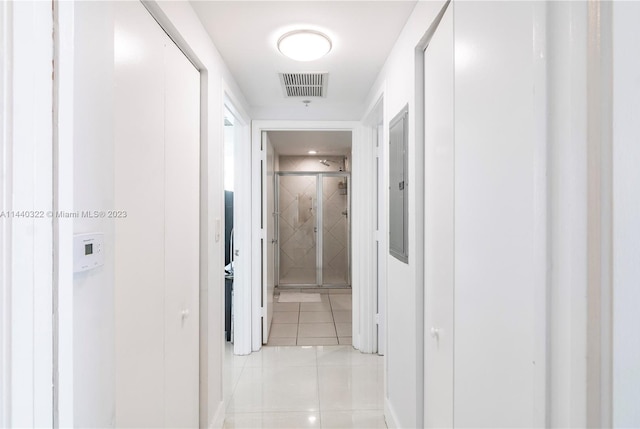 hall featuring light tile floors