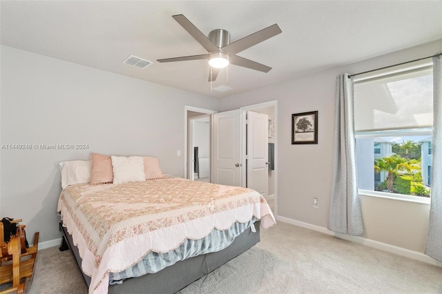 bedroom featuring ceiling fan and light colored carpet