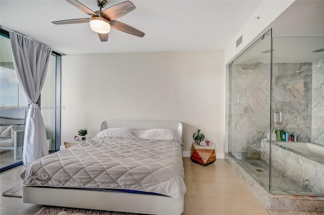 bedroom with ceiling fan, a closet, floor to ceiling windows, and light hardwood / wood-style flooring