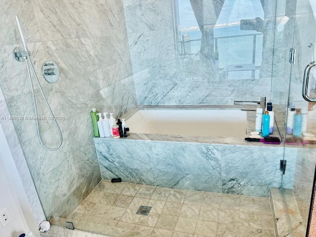 bathroom with shower with separate bathtub