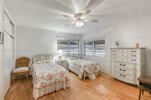 bedroom featuring light hardwood / wood-style floors and ceiling fan