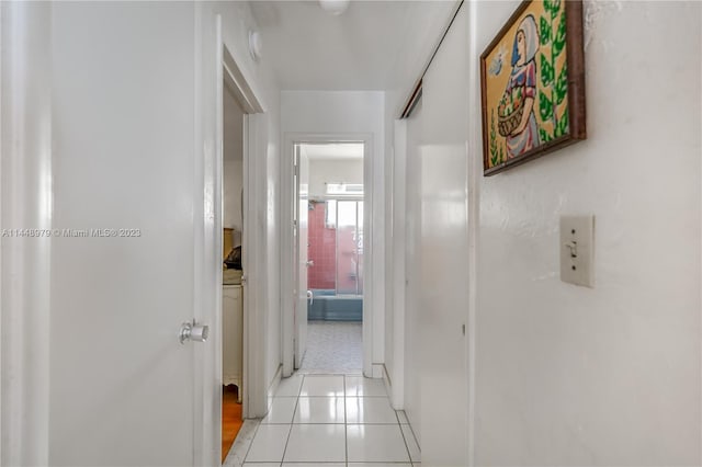 hallway featuring light tile floors