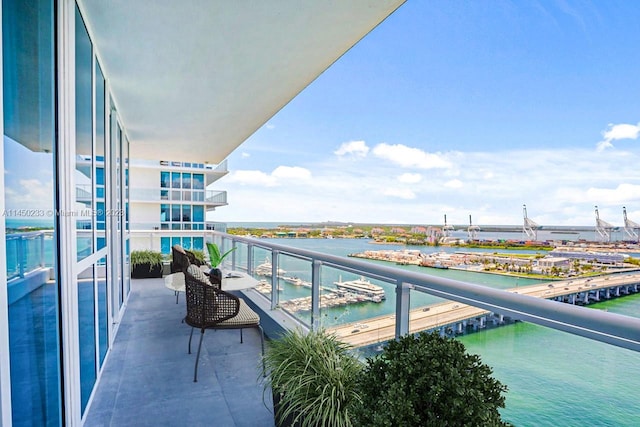 balcony featuring a water view