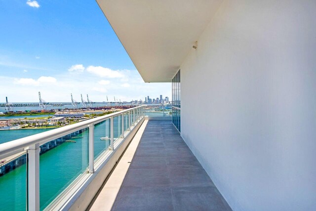 balcony featuring a water view