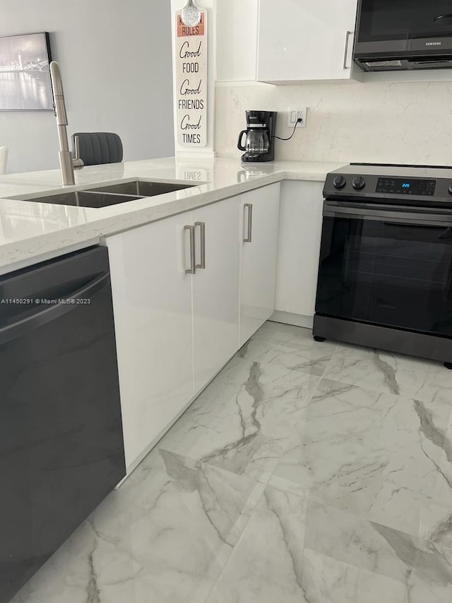 kitchen with white cabinetry, black appliances, sink, light tile floors, and light stone counters