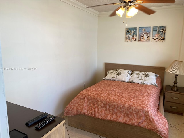 bedroom featuring crown molding, ceiling fan, and light tile floors