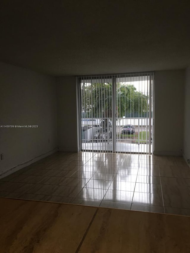 view of tiled spare room