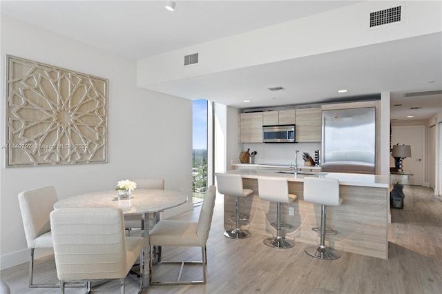 dining area with light wood-type flooring