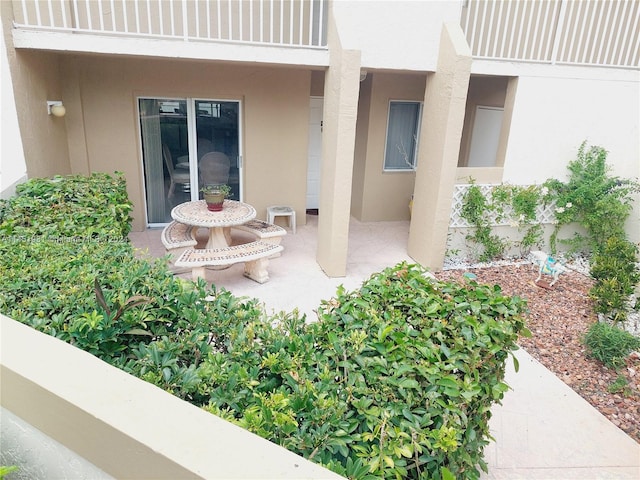 doorway to property featuring a patio