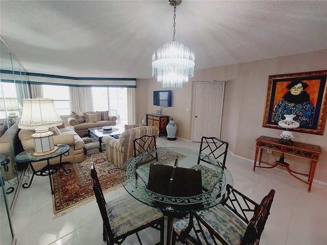 dining space with a notable chandelier, a textured ceiling, light tile floors, and vaulted ceiling