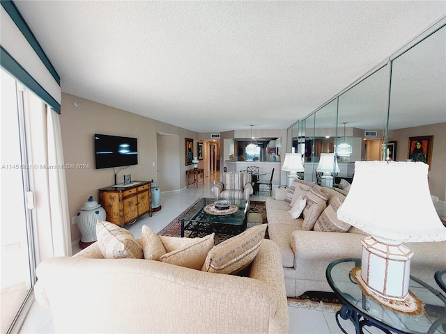 tiled living room with a textured ceiling