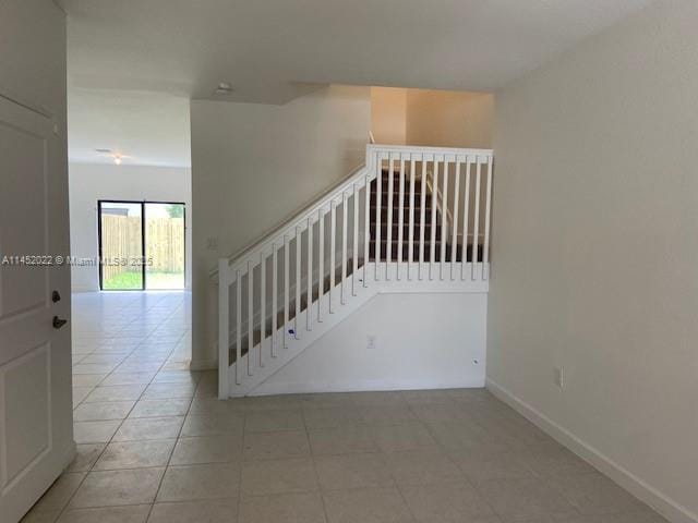 staircase with tile patterned flooring