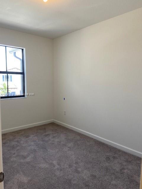 view of carpeted spare room