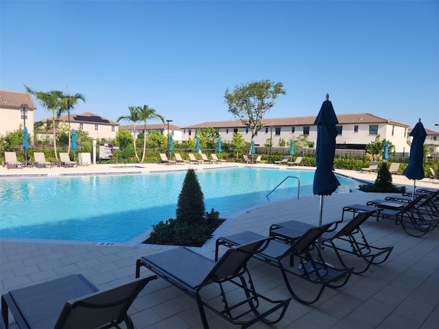 view of pool featuring a patio