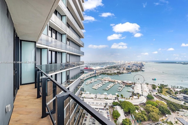 balcony featuring a water view