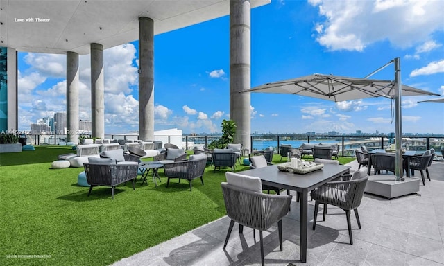 view of patio / terrace featuring outdoor lounge area and a water view