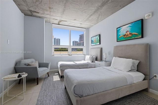 bedroom featuring light tile patterned floors