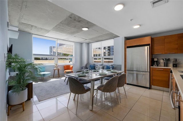 dining area featuring light tile patterned floors