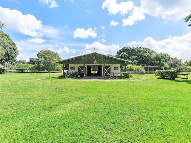 back of property featuring a yard