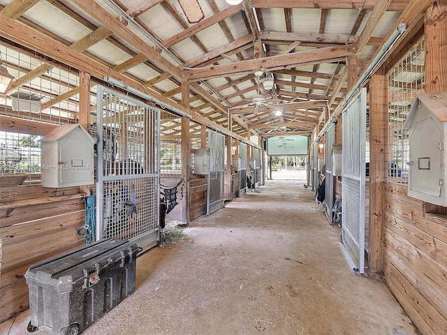 view of horse barn with an outdoor structure