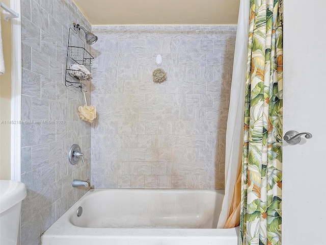 bathroom with shower / bath combination with curtain