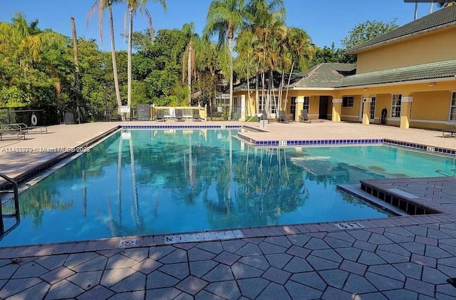 view of swimming pool featuring a patio