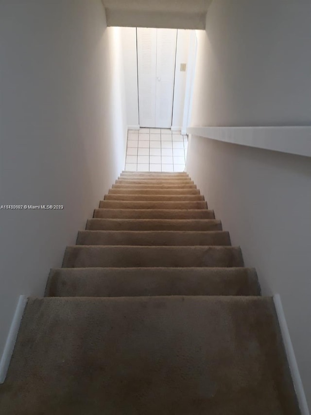 staircase with tile floors