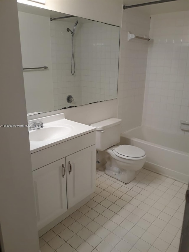 full bathroom with toilet, vanity, tiled shower / bath, and tile flooring