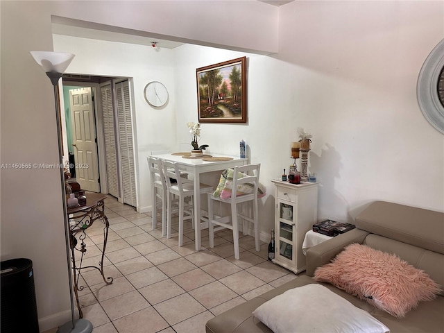 living room featuring light tile floors