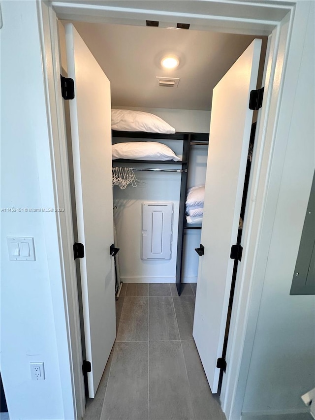 corridor featuring light tile flooring