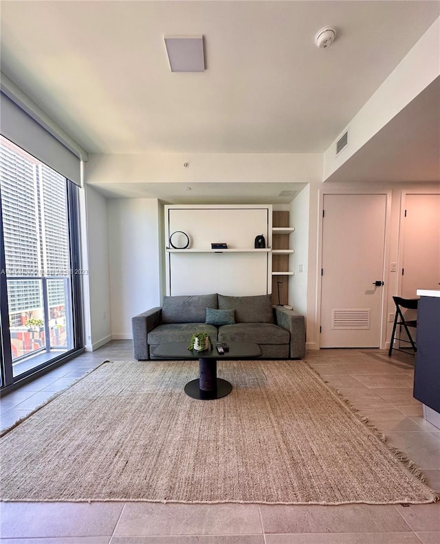 living room featuring light tile floors