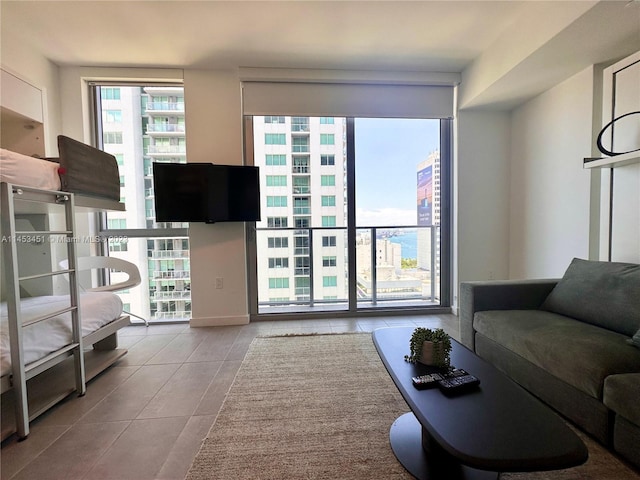 living room featuring light tile floors and a wealth of natural light