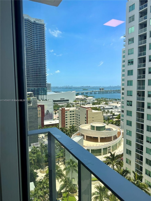 balcony featuring a water view