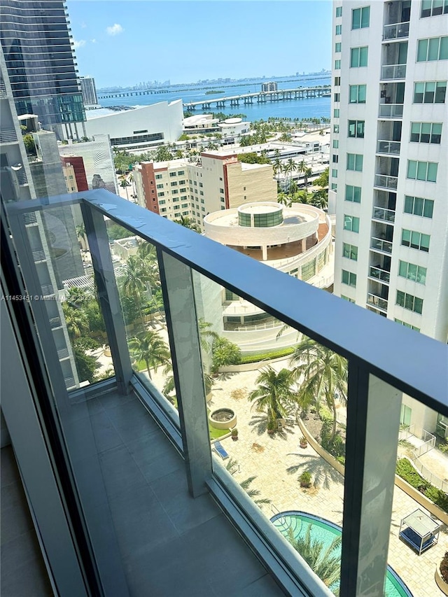 balcony featuring a water view