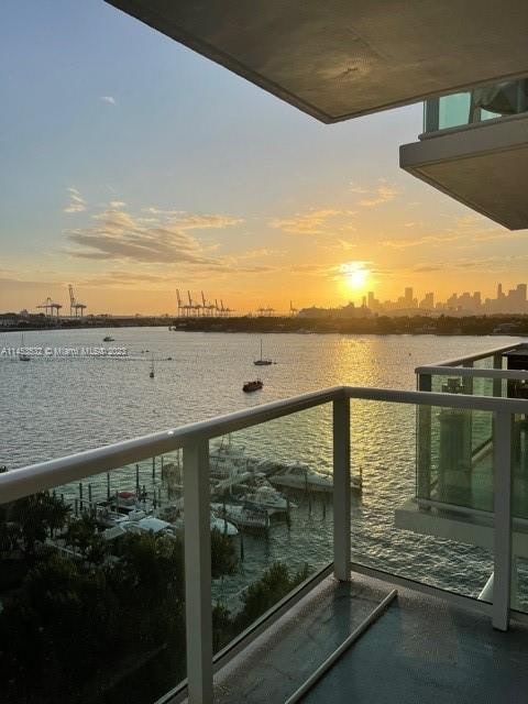 balcony at dusk with a water view