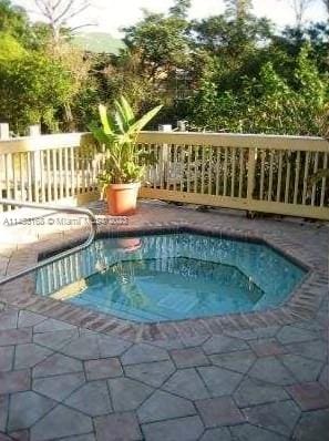 view of swimming pool with a patio area