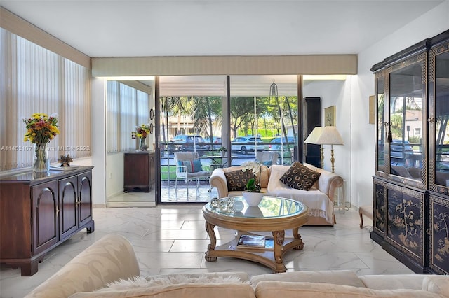 tiled living room featuring a healthy amount of sunlight