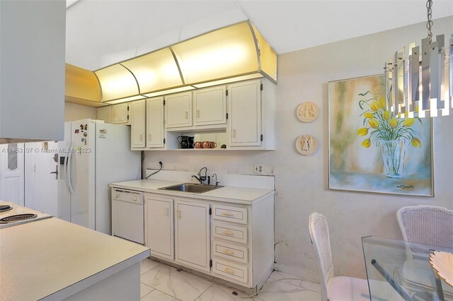 kitchen featuring white appliances, sink, and light tile floors