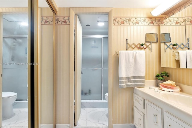 bathroom featuring an enclosed shower, vanity, tile floors, and toilet