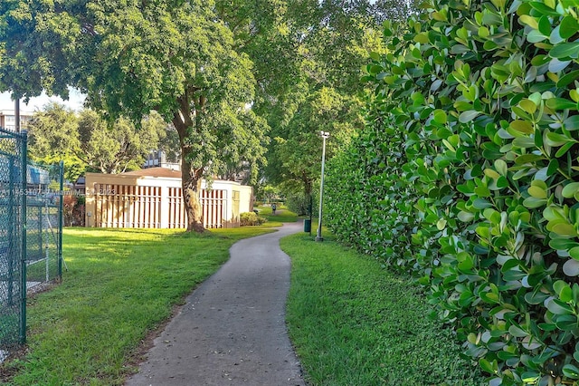 view of property's community featuring a lawn