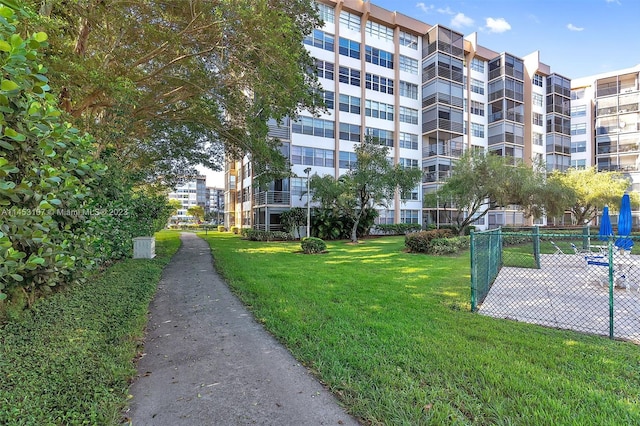 view of property's community with a lawn