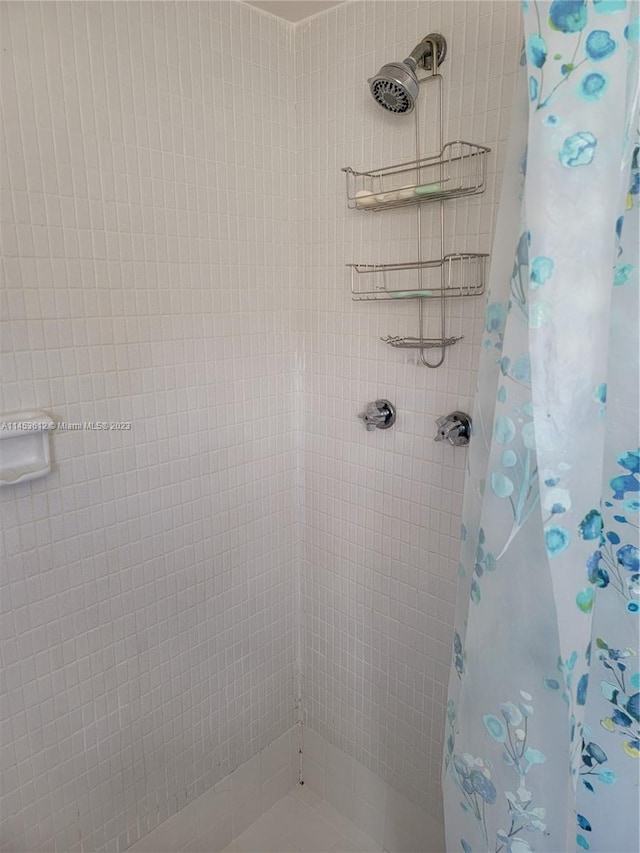 bathroom with a shower with curtain