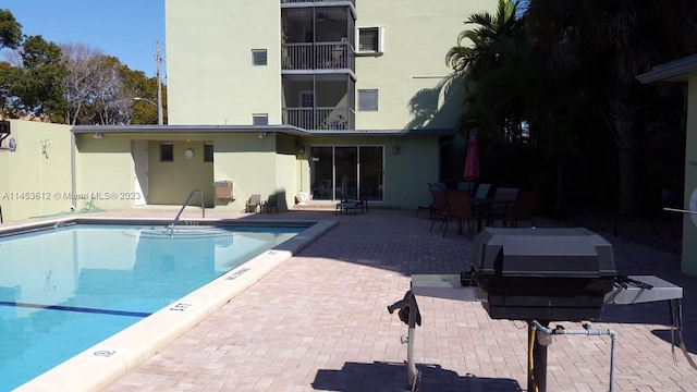 view of swimming pool with a patio area