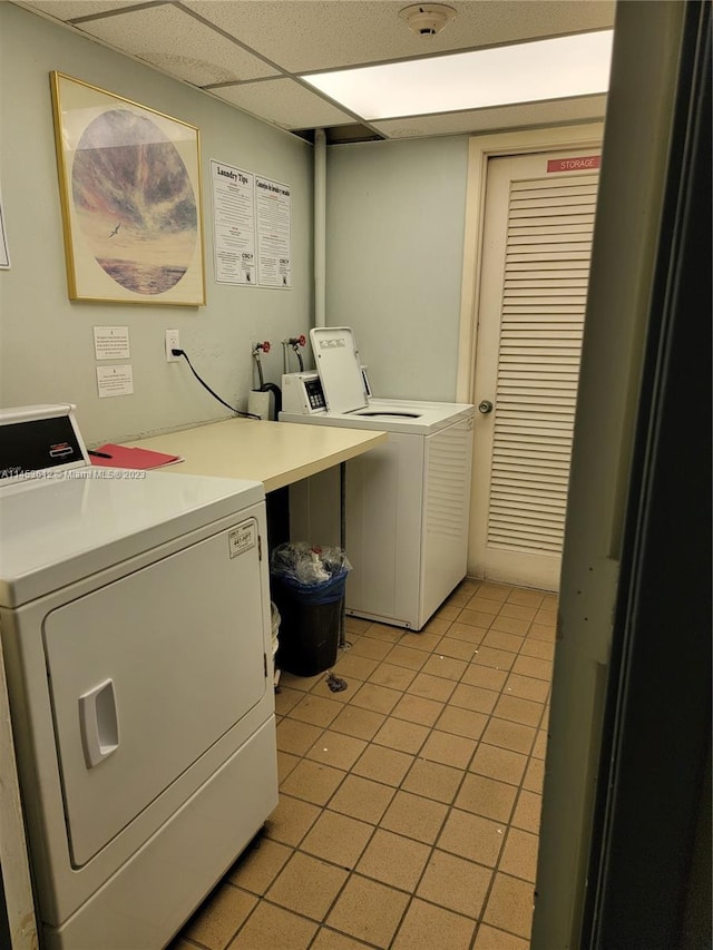 laundry room with light tile flooring, washer hookup, and independent washer and dryer